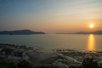 The sun sets on beautiful beach in Thailand, Phuket.