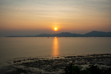 The sun sets on beautiful beach in Thailand, Phuket.