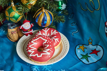 Christmas table decoration with a cake and toy Santa   