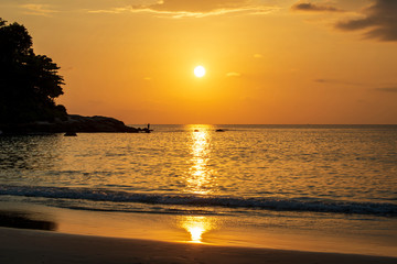 Beautiful golden sunset over the ocean. Bright sunset golden waves.