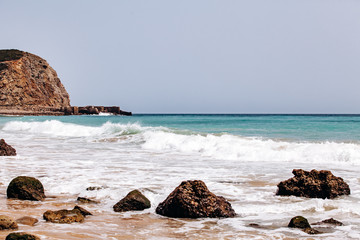 Beautiful view of the sea waves from the rocks in algarve, Portugal