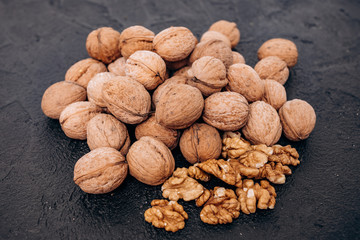 Walnuts on black background are ready to eat.