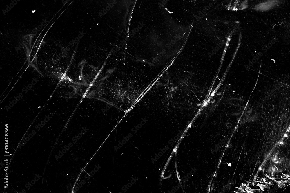 Poster grunge background with scratches on a black