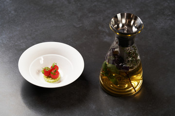 Fresh peeled chili tomatoes and minced cucumbers on dark background