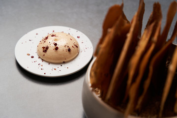 Cereal Chips with Seeds and kimchi mayonnaise sauce on dark background