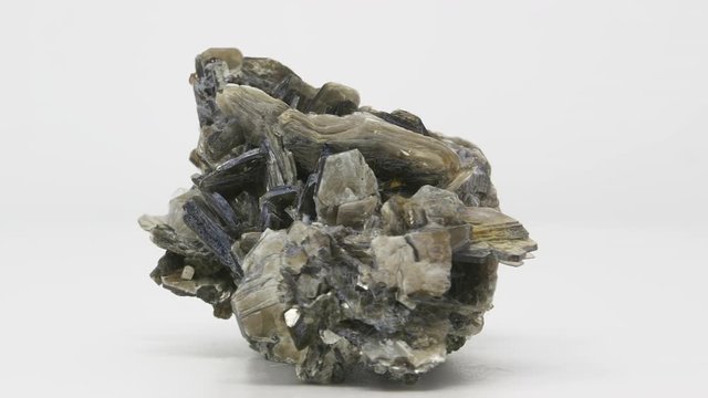 Extremely close view of Muscovite crystal formation. Rotating completely. Looping
