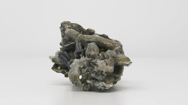 Very close view of Muscovite crystal formation. Rotating completely. Looping