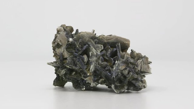 Very close view of Muscovite crystal formation. Rotating front to back.