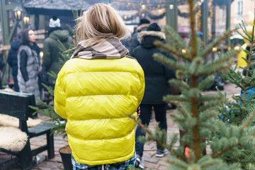 Happy woman with a cup of hot drink on the Christmas market © blackday