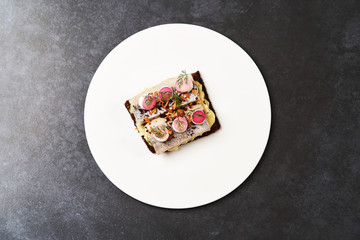Smorrebrod with Baltic herring fish, smoked mousse and pickled onions