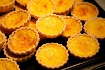 tart egg custard baked crispy sweet dessert .