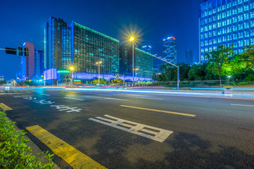 Empty asphalt road through modern city in Nnajing, China.