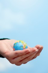 Closeup Of Hand Holding Globe