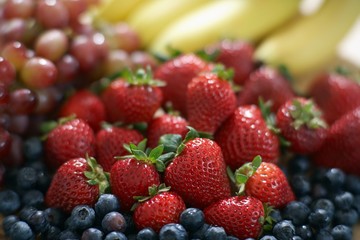Strawberries Piled Up On Blackberries