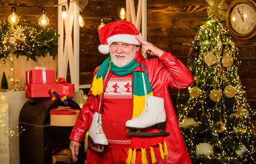 perfect skates. winter season activity. holiday time spending outdoor. cheerful santa man figure...