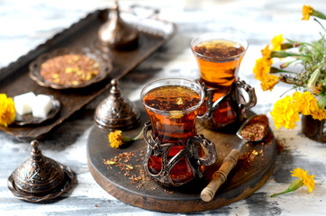 Turkish traditional tea on a white wooden background