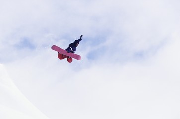 Person On Snowboard Jumping Midair