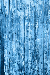 Fototapeta na wymiar Wooden background of old fence with rusty nails. Shabby texture of classic blue colored wooden boards.
