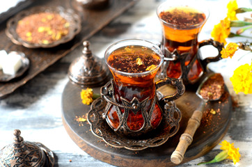 Turkish traditional tea on a white wooden background