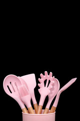 Kitchen utensils background with copyspace, home kitchen decor concept, kitchen tools, rubber accessories in container. Restaurant, cooking, culinary, kitchen theme. Silicone spatulas and brushes