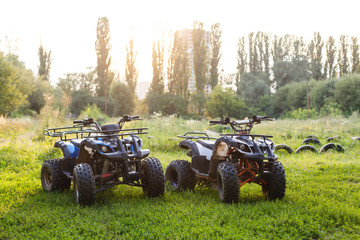 two ATVs stand in the field © Angelov