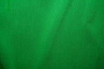 Dark green Fabric Textile Material, abstract background for design with soft waves.