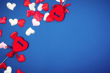 Red heart for Valentine's Day on a beautiful blue background. Heart pendant. Space for text. Red...