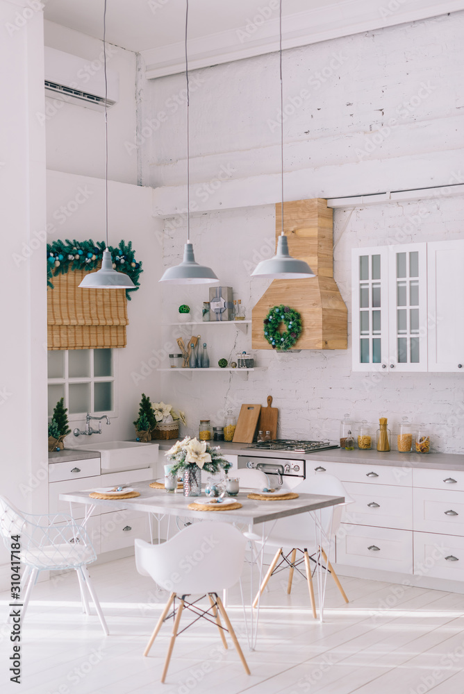 Wall mural interior of a bright modern kitchen in vintage style, decorated with christmas decor