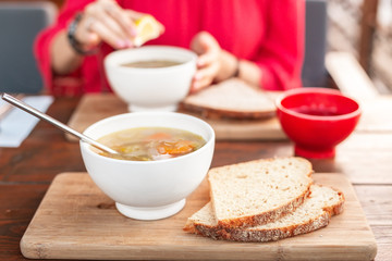Eating vegetarian soup in outdoor cafe