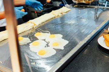 eggs in the kitchen of the restaurant scrambled egg yolk protein