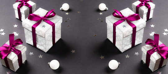 Christmas gifts, ornaments on black background. Winter holiday xmas present. Merry Christmas and...