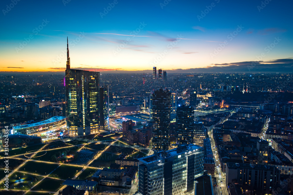 Wall mural milan (italy) night aerial view. panoramic view from the lombardy region building.