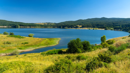 Naklejka na ściany i meble Summer landscape along the road to Camigliatello, Sila. Cecita lake