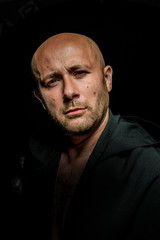 Portrait of a courageous warrior wanderer in a black cloak. Historical fantasy. Halloween