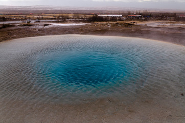 The eruption of the Strokkur geyser in the southwestern part of Iceland in a geothermal area near the river Hvitau