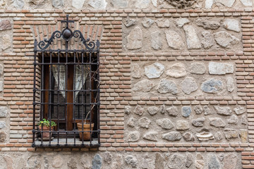 wooden window on brick wall