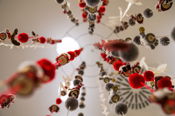 December Christmas hanging decoration close up, bottom view, blurred lights in the background / Christmas texture backdrop icon/ space for text