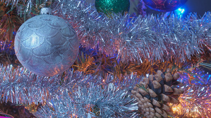 silver ball on a Christmas tree, cold tones