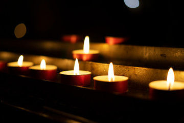 Candles lit red during a session of spiritualism. Concept of occultism.