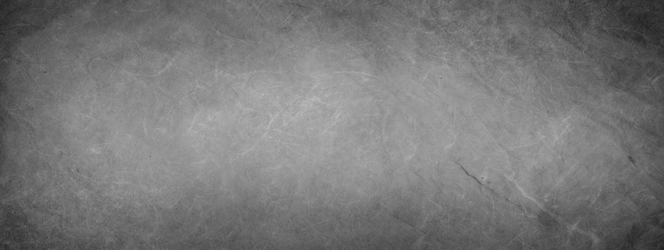 Elegant black parchment paper texture horizontal empty background. Vintage textured web banner header board. Dark distressed texture wallpaper. Luxury antique card. Website background