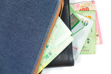 brown leather wallet with credit card (visa) and thai banknotes isolated on white background. Wallet with cash and credit card. Choose to buy or shoping.