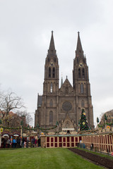 Fototapeta premium Czech capital, Prague. Church of St. Ludmila and Peace Square with the Christmas market on the eve of Christmas in festive decoration.