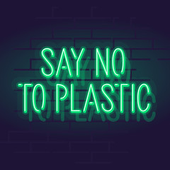 Neon say no to plastic lettering. Isolated glowing text illustration on eco living on brick wall background.
