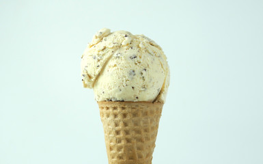 Chocolate Chip flavor ice cream scoop in waffle cone on White background, Closeup Front view Food concept...