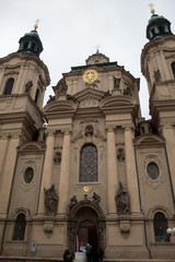 Prague / Czech Republic - November 23 2019: Old Town Square is the heart of the Czech city of Prague with many churches, old houses, a town hall and Prague chimes on Christmas Eve.