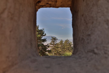 Forrest and mountain view from an arrowslit in Râșnov citadel