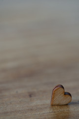 close up of heart on wooden background copy space for text or image 