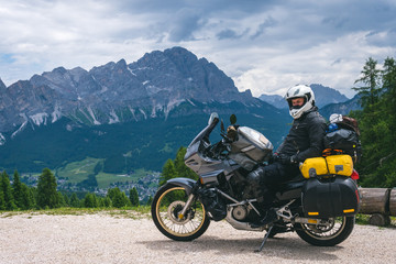 Biker man is sitting on adventure touring motorcycle take a rest after long road trip, Top...