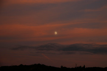 Golden hour with the Moon in the sky