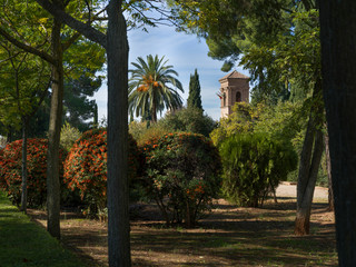 Fototapeta na wymiar Bell tower seen from garden of Alhambra Palace, Alhambra, Granada, Spain